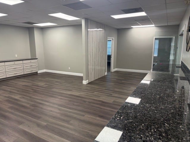 Open suite — League City Open suite with granite counter and room divider, suitable for a growing team