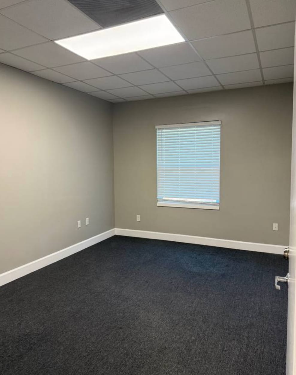 Private office — League City Bright private office with a window and neutral finishes, ready for a small business owner